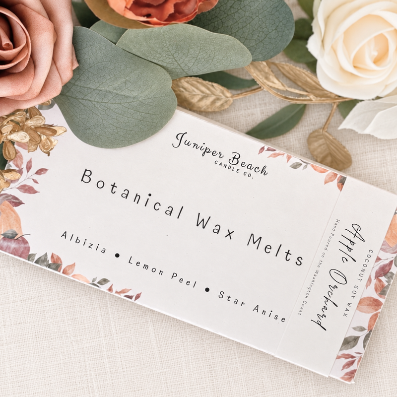 Apple Orchard botanical wax melts box styled with soft florals and eucalyptus on neutral linen