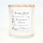 Bergamot Shore 11 oz candle in a white glass jar with a natural pine lid