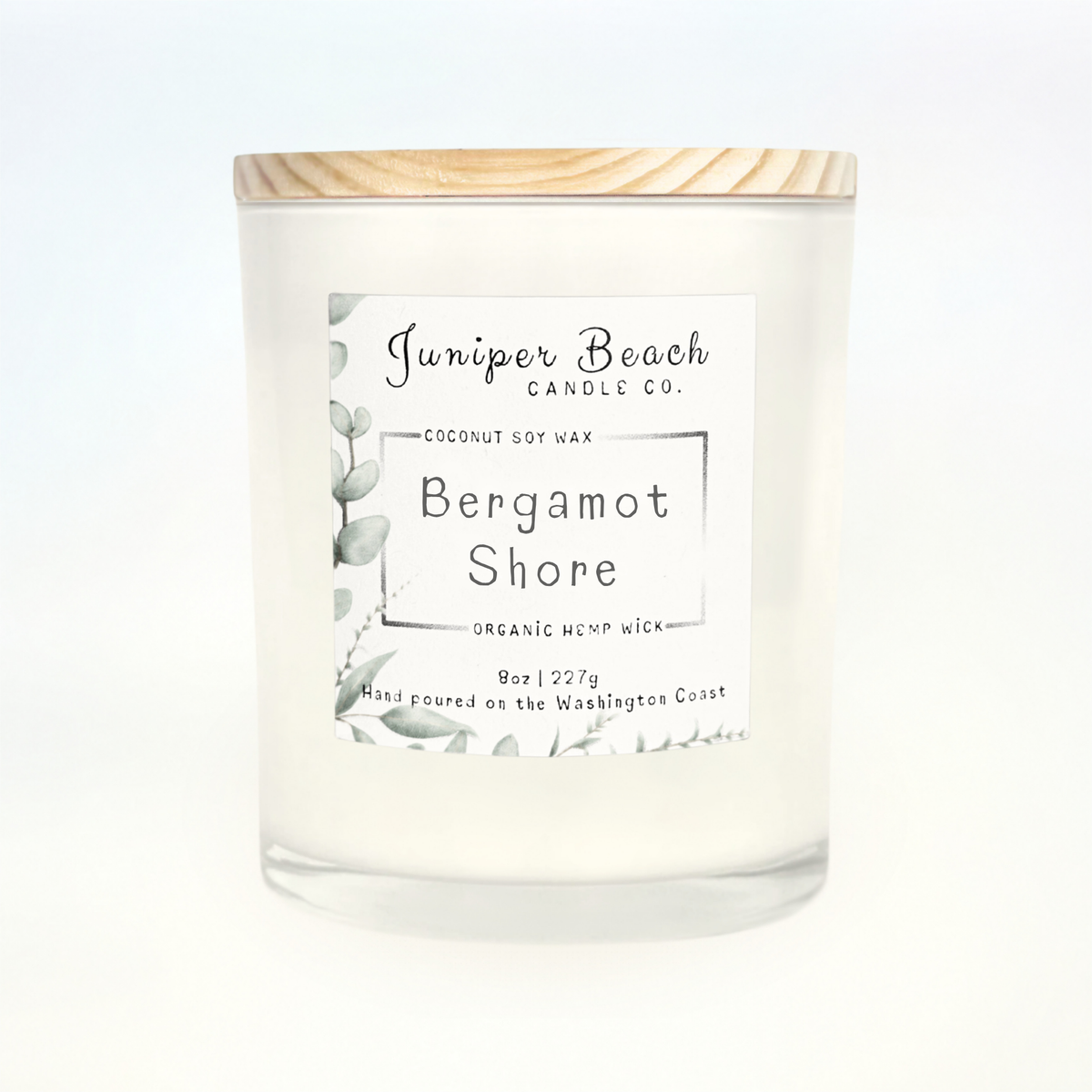 Bergamot Shore 8 oz candle in a white glass jar with a natural pine lid