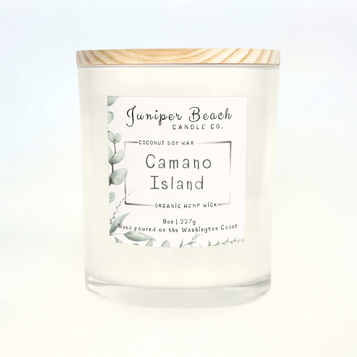 Camano Island 8 oz candle in a white glass jar with a natural pine lid