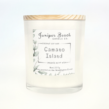 Camano Island 8 oz candle in a white glass jar with a natural pine lid