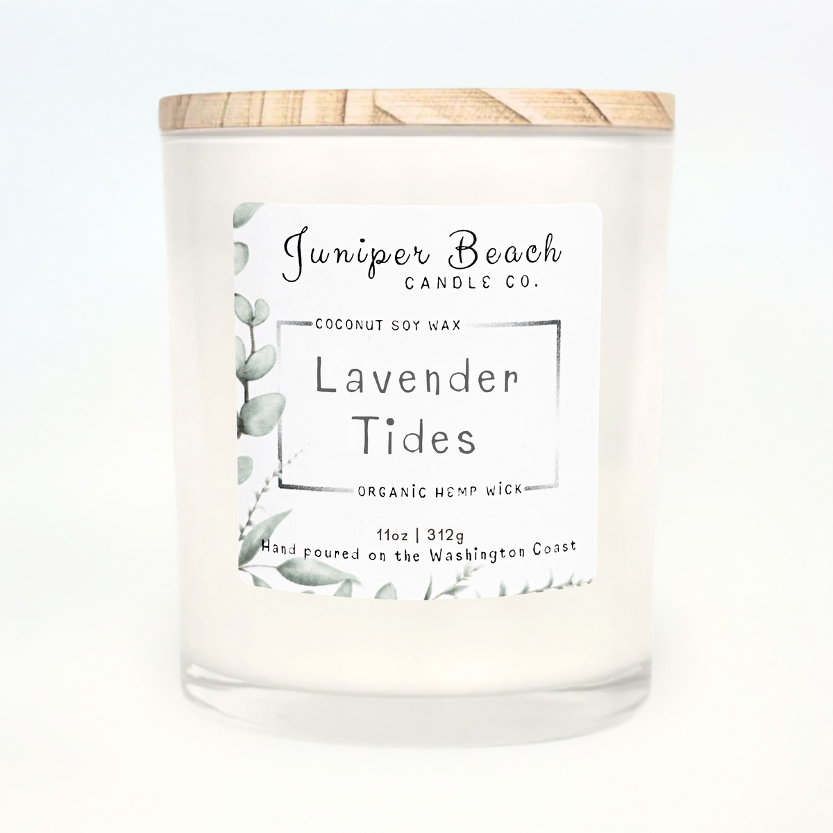 Lavender Tides 11 oz candle in a white glass jar with a natural pine lid