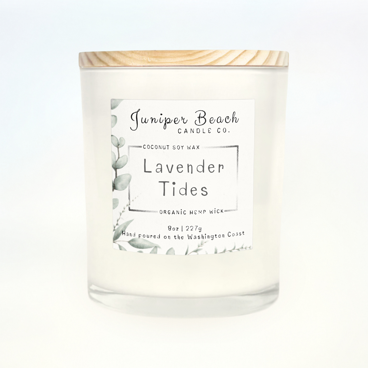 Lavender Tides 8 oz candle in a white glass jar with a natural pine lid