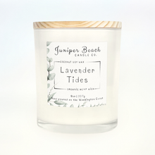 Lavender Tides 8 oz candle in a white glass jar with a natural pine lid