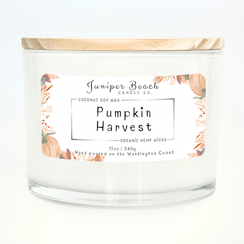 Pumpkin Harvest 12 oz candle in a white glass jar with a natural pine lid