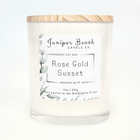 Rose Gold Sunset 11 oz candle in a white glass jar with a natural pine lid