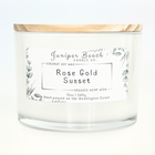 Rose Gold Sunset 12 oz candle in a white glass jar with a natural pine lid