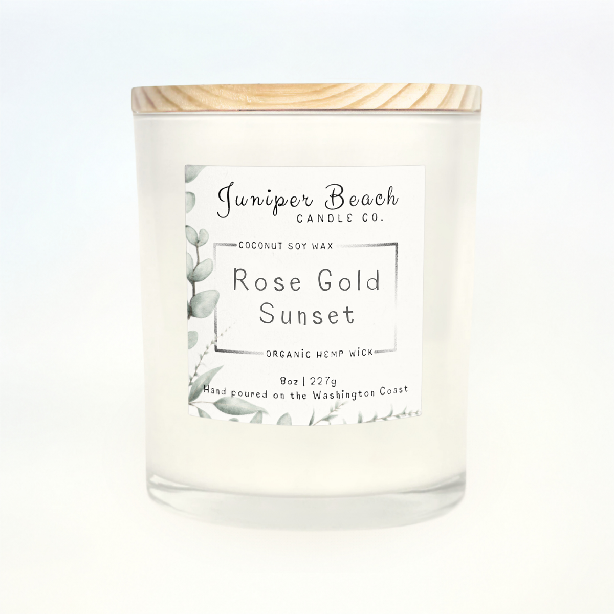 Rose Gold Sunset 8 oz candle in a white glass jar with a natural pine lid