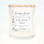 Salt Water Mist 11 oz candle in a white glass jar with a natural pine lid
