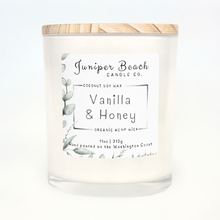 Vanilla & Honey 11 oz candle in a white glass jar with a natural pine lid