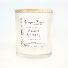 Vanilla & Honey 8 oz candle in a white glass jar with a natural pine lid