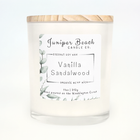Vanilla Sandalwood 11 oz candle in a white glass jar with a natural pine lid