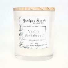 Vanilla Sandalwood 11 oz candle in a white glass jar with a natural pine lid