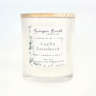 Vanilla Sandalwood 8 oz candle in a white glass jar with a natural pine lid